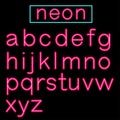 Pink glowing Neon Bar Alphabet on black background. Royalty Free Stock Photo