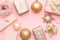 Pink and gold christmas gifts isolated on pastel pink background. Christmas mock up. Royalty Free Stock Photo