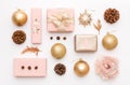 Pink and gold christmas gifts isolated on white background. Wrapped xmas boxes, christmas ornaments, baubles and pine cones.