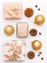 Pink and gold christmas gifts isolated on white background. Wrapped xmas boxes, christmas ornaments, baubles and pine cones Royalty Free Stock Photo