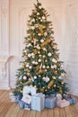 Pink and gold christmas tree with gifts. Christmas presents under tree. New Year Card Template.Christmas tree with toys. greeting Royalty Free Stock Photo