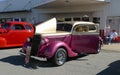 Pink and gold vehicle, antique, at car show