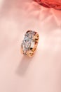 Pink gold and white gold ornament ring with diamond on pastel background Royalty Free Stock Photo