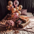 pink and golden balloons with gifts and a gift box on the bed