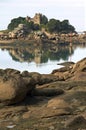 Pink granite coast and castle Costaeres Royalty Free Stock Photo