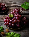 Pink grape on wooden table on wooden background. Vine grape. Still life of food. Royalty Free Stock Photo