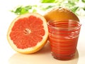 Pink grapefruit with juice Royalty Free Stock Photo