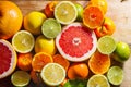 Pink grapefruit and other citrus fruit against wooden background Royalty Free Stock Photo