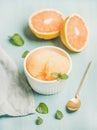 Pink grapefruit sorbet with fresh mint in white bowl Royalty Free Stock Photo