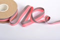 Pink and gray Cotton ribbon, roll textilies on bobbin. strapping tape and rope Lime Webbing with curl on white backgroud