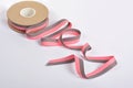 Pink and gray Cotton ribbon, roll textilies on bobbin. strapping tape and rope Lime Webbing with curl on white backgroud