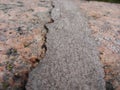 Pink-gray granite and old cement. background, texture. the parapet of the River. Granite stone abstract texture background. Royalty Free Stock Photo