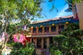 A pink and green and brown building with a Chinese temple roof in Chinatown in Los Angeles