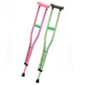 Pink and green crutches isolated on white background Royalty Free Stock Photo