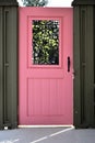 Pink and green door black metal wrought iron Royalty Free Stock Photo