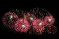 Pink and green fireworks and scattering of gold sparks Royalty Free Stock Photo