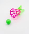 Pink and green hand basketball toy isolated on white