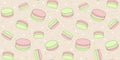 Cute seamless pattern with pink and green macaroons on a beige background with small stars and dots