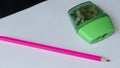 Pink and green pencil and sharpener Royalty Free Stock Photo