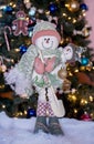 Pink and green snowman with a baby snowman Royalty Free Stock Photo