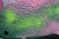 Pink, green, white, black painted grunge plaster wall surface background with colorful drips, flows, streaks of paint Royalty Free Stock Photo