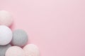 Pink, grey and white balls on a pastel background with copy space Royalty Free Stock Photo