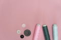 Pink grey white tread and button for sewing or embroidery on background fashion and cloth industry