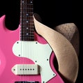 Pink Guitar with Girl's Western Hat Royalty Free Stock Photo