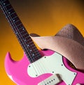 Pink Guitar and Western Hat Royalty Free Stock Photo