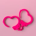 Pink handcuffs on pastel background Royalty Free Stock Photo