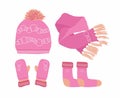 Pink Hat with a Pompom, Scarf, socks and Mitten Set Knitted Seasonal Winter Traditional Accessories with Ornament. Royalty Free Stock Photo