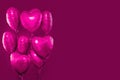 Pink heart balloons on bright pink card background