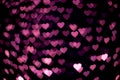Pink heart bokeh in the dark. Royalty Free Stock Photo