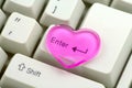 Pink heart and enter key, love concept Royalty Free Stock Photo