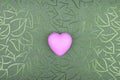 Pink heart on green textured floral background Royalty Free Stock Photo