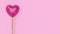 Pink heart lollipops isolated on pink background