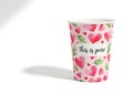 Pink heart patterned paper cup with this is prose text Royalty Free Stock Photo