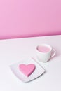 Pink heart in a plate and cup of pink milkshake Royalty Free Stock Photo