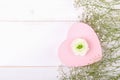 Pink heart shape gift box on a white backround with small withe flowers Royalty Free Stock Photo