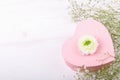 Pink heart shape gift box on a white backround with small withe flowers Royalty Free Stock Photo