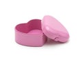 Pink heart-shaped container with open lid on a plain background Royalty Free Stock Photo