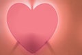 Pink heart-shaped fire on red background on orange Royalty Free Stock Photo