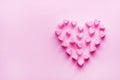 Pink heart-shaped marshmallows stacked on a pink background with space for copy. Marshmallow heart.Valentine`s day concept theme Royalty Free Stock Photo