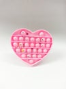 pink heart shaped pop it toy