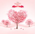 Pink heart-shaped sakura trees. Valentine`s day.