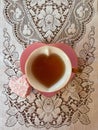 Pink heart shaped teacup with heart shaped frosted cake