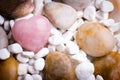 Pink heart stone on the spa stone background. Royalty Free Stock Photo