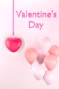 Pink heart tag and balloons on pink background. Happy Valentime`s day concept Royalty Free Stock Photo