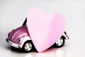 Pink heart on pink toy car Royalty Free Stock Photo