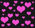 Pink hearts of different sizes on a black background Royalty Free Stock Photo
